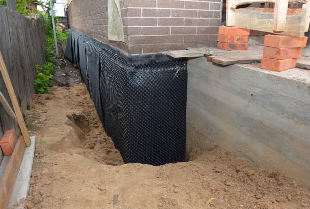 Happy homeowners after waterproofing job in Romeo